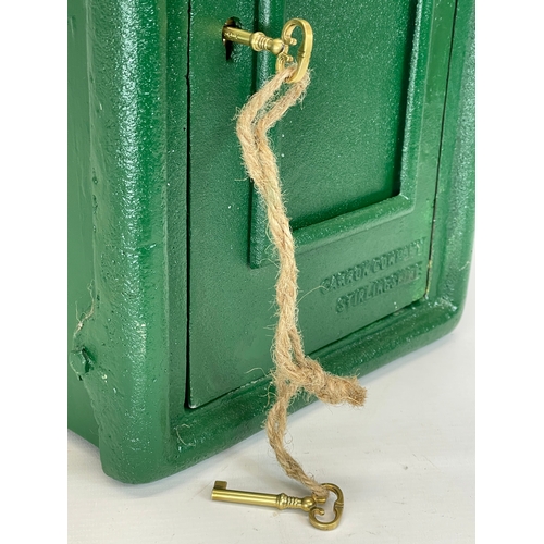 224 - A cast iron postbox with key. 25x35x59cm