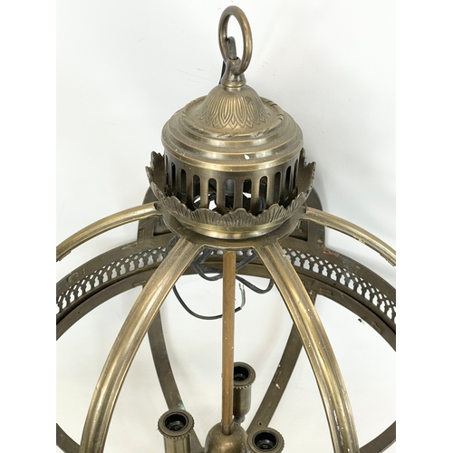 242 - A large brass light fitting. 46x65cm