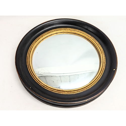 257 - A modern convex mirror. 52.5cm