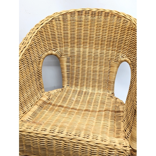 262 - A pair of child's wicker chairs. 46x46x55cm