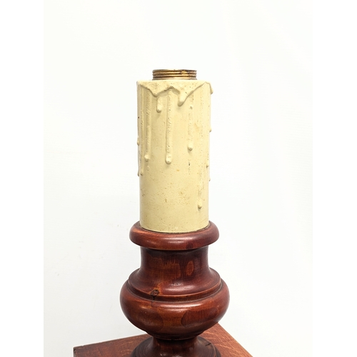 431 - A large pair of wooden table lamps
 75.5cm