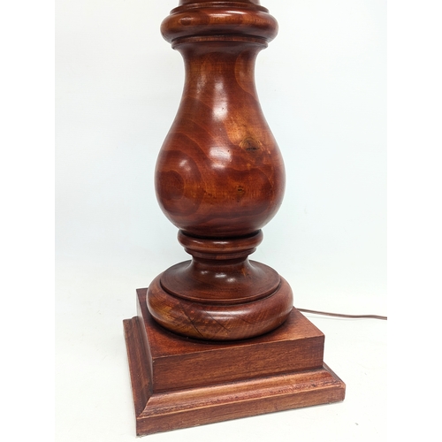 431 - A large pair of wooden table lamps
 75.5cm