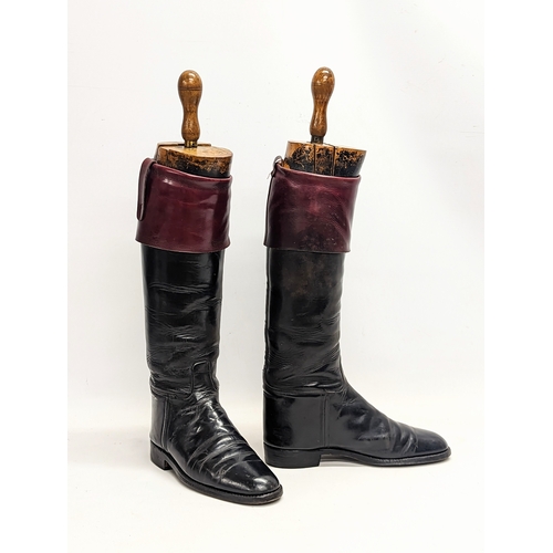 248 - A pair of Victorian riding / hunting boots by Fussell's, with 
wooden Victorian stretchers. Height m... 