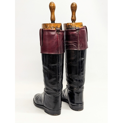 248 - A pair of Victorian riding / hunting boots by Fussell's, with 
wooden Victorian stretchers. Height m... 