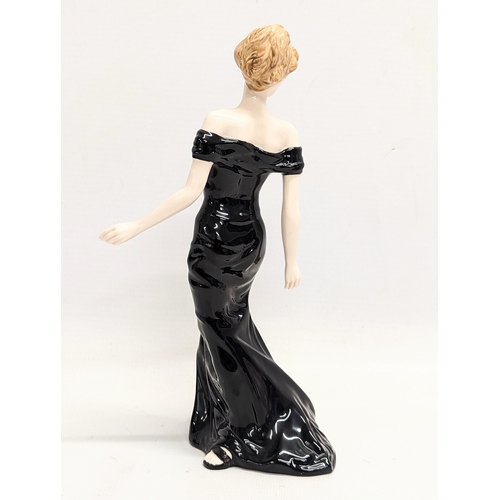 447 - A Royal Doulton pottery figurine, In Vogue 