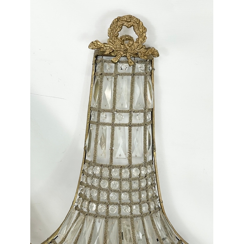 249 - A pair of large French Empire style ornate brass basket wall lights with crystal droplets. 32x71cm