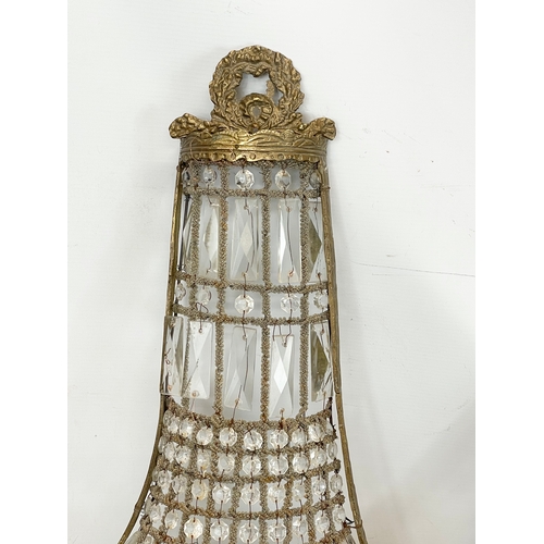 249 - A pair of large French Empire style ornate brass basket wall lights with crystal droplets. 32x71cm