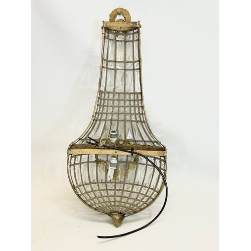 249 - A pair of large French Empire style ornate brass basket wall lights with crystal droplets. 32x71cm