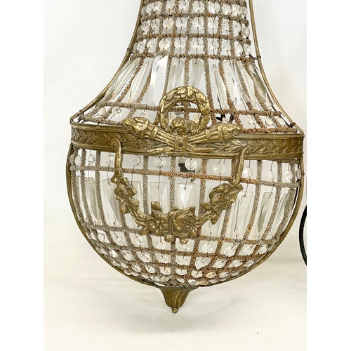 249 - A pair of large French Empire style ornate brass basket wall lights with crystal droplets. 32x71cm