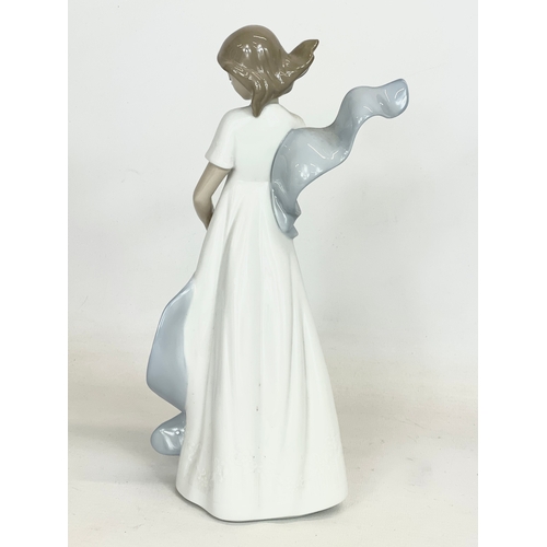 500 - A Nao pottery figurine ‘Kissed By The Wind’ 25cm