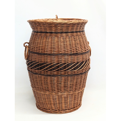 269 - A large good quality wicker 2 handled linen hamper with lid. 59cm