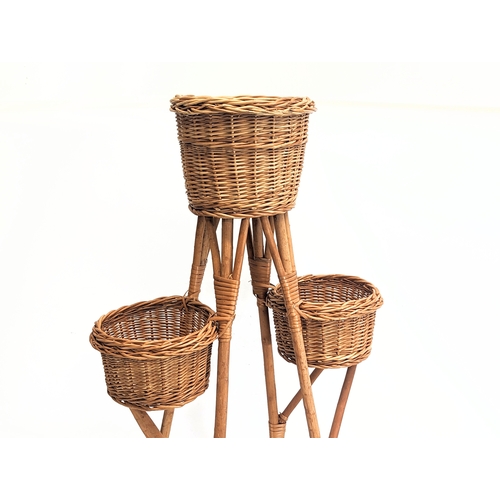 270 - A tall good quality wicker plant stand. 104cm