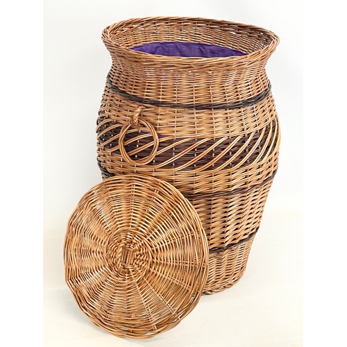 271 - A large good quality wicker linen hamper with handles and lid. 61cm