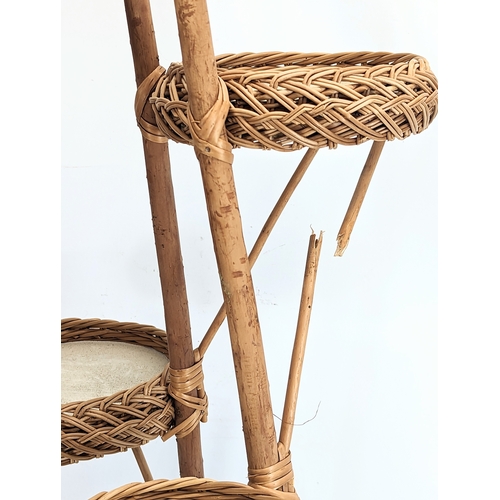 278 - A good quality tall wicker plant stand with wicker magazine rack. Plant stand measures 113cm