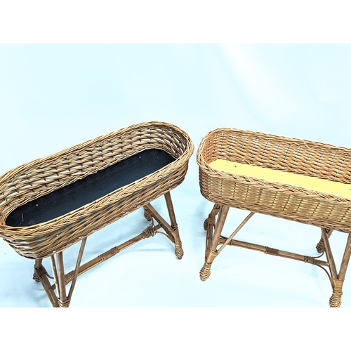 281 - A near pair of good quality wicker planters. 68x29x59.5cm