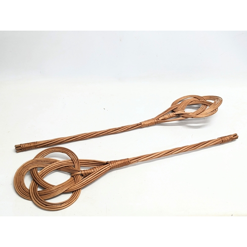 285 - 4 pieces of good quality wicker including 2 rug beaters, serving tray and stick stand. Stick stand m... 