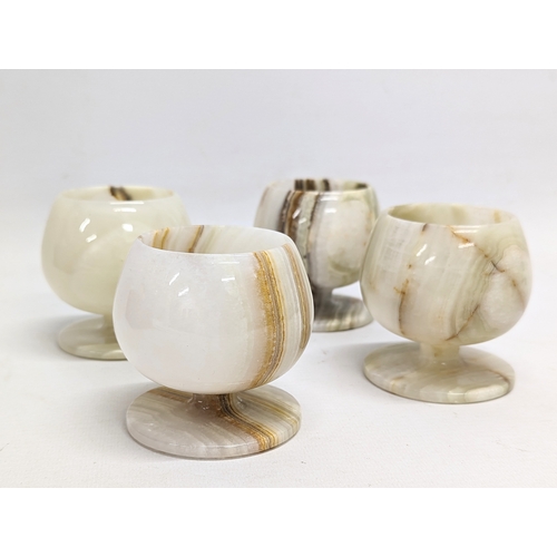 711 - A set of 4 onyx brandy cups