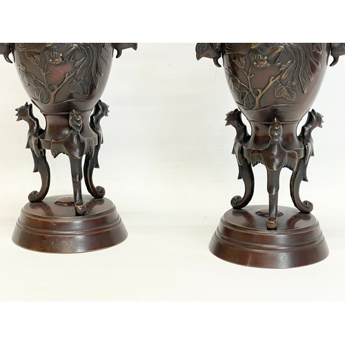 259 - A pair of late 19th century Japanese bronze vases. 24.5cm