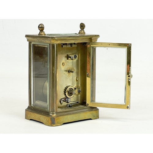 329 - An early 20th century brass carriage clock. 8 x 6 x 11cm