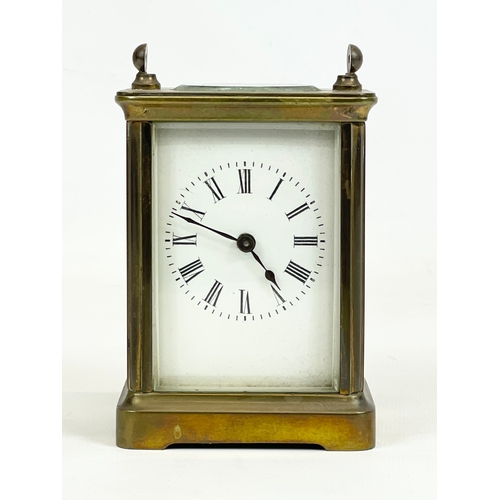 329 - An early 20th century brass carriage clock. 8 x 6 x 11cm