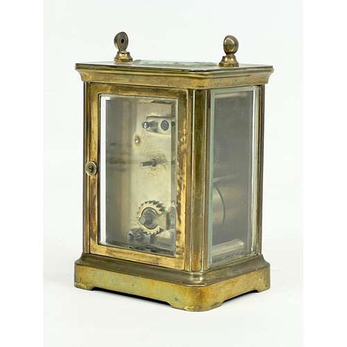 329 - An early 20th century brass carriage clock. 8 x 6 x 11cm