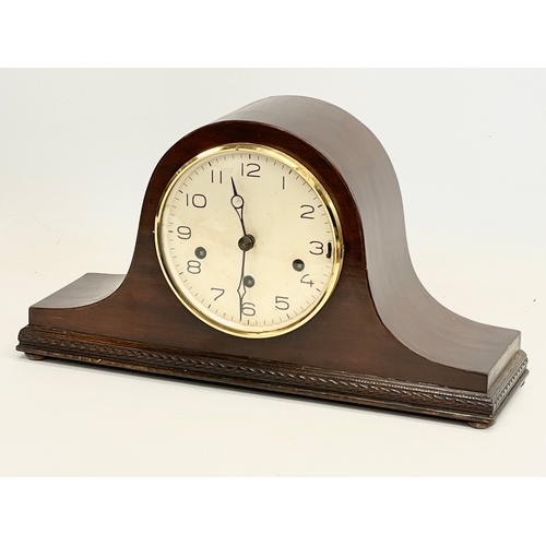 367 - A 1930’s mahogany cased mantle clock with key and pendulum. 42x12x13cm