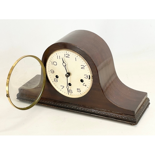 367 - A 1930’s mahogany cased mantle clock with key and pendulum. 42x12x13cm