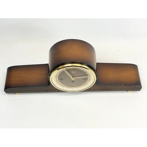 368 - A vintage Hermle walnut and brass mantle clock. No key or pendulum. 51x10x20cm