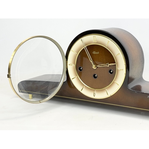 368 - A vintage Hermle walnut and brass mantle clock. No key or pendulum. 51x10x20cm