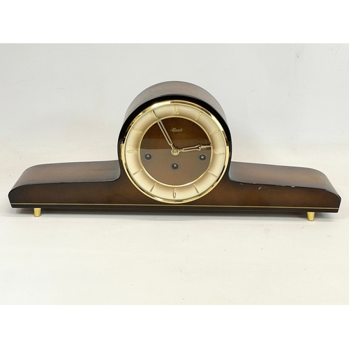 368 - A vintage Hermle walnut and brass mantle clock. No key or pendulum. 51x10x20cm