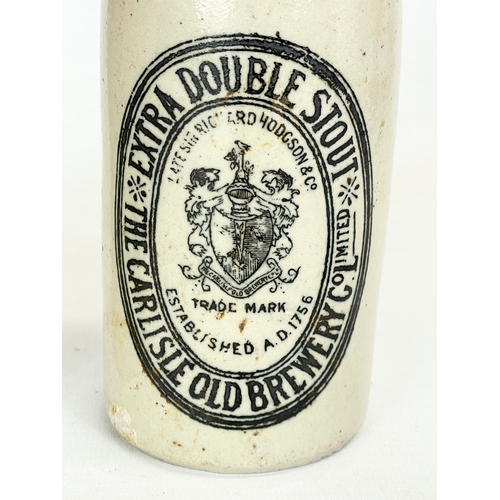 371 - A Victorian stoneware cream pot from Newtownbutler and a ginger bear bottle from The Carlisle Old Br... 