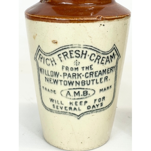 371 - A Victorian stoneware cream pot from Newtownbutler and a ginger bear bottle from The Carlisle Old Br... 