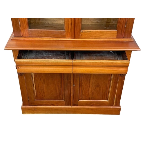 321 - A Victorian style mahogany bookcase with 2 drawers. 115 x 46.5 x 206.5cm