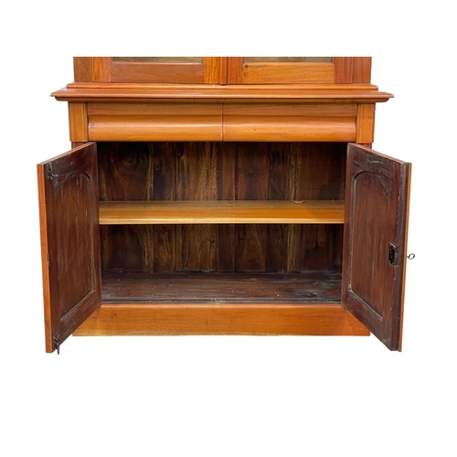 321 - A Victorian style mahogany bookcase with 2 drawers. 115 x 46.5 x 206.5cm