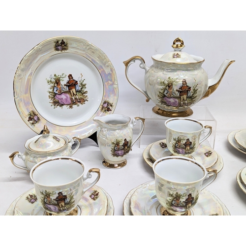 705 - 23 piece Chodziez tea set, including tea pot.