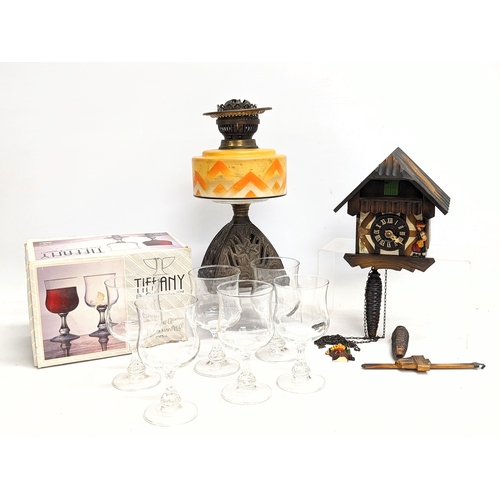 703 - Sundry lot including a late Victorian oil lamp, cuckoo clock, 6 drinking glasses.