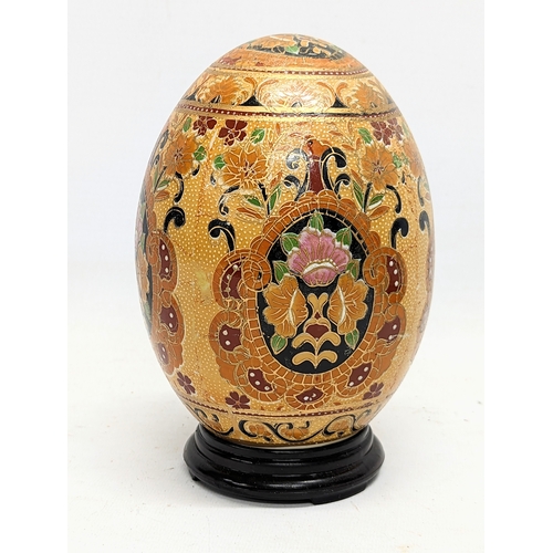 699 - A Japanese satsuma pottery egg. 17.5cm