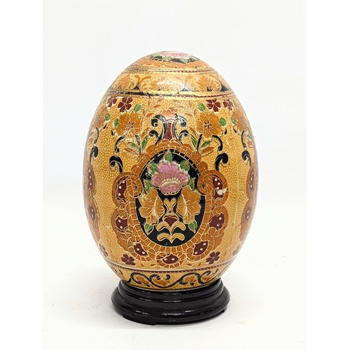 699 - A Japanese satsuma pottery egg. 17.5cm