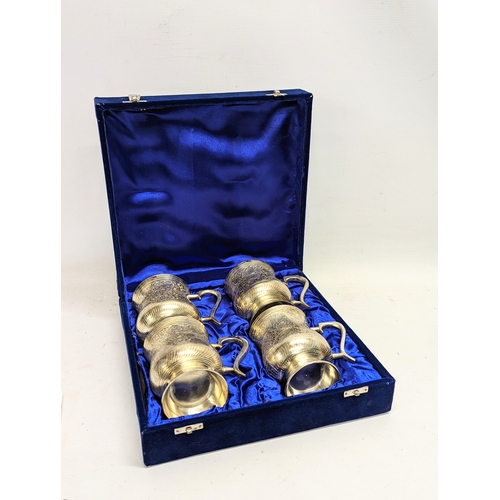 698 - A set of 4 E. P. N. S.  tankards in case