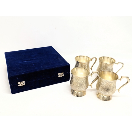 698 - A set of 4 E. P. N. S.  tankards in case