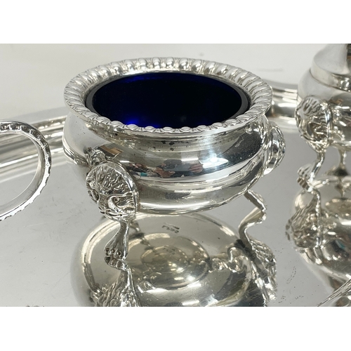 637 - A good quality 3 piece silver plated cruet set with tray. Tray measures 32cm