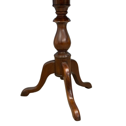 264 - A mahogany pedestal end table.