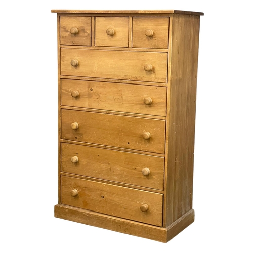 267 - A tall heavy pine chest of drawers. 91x48x147cm