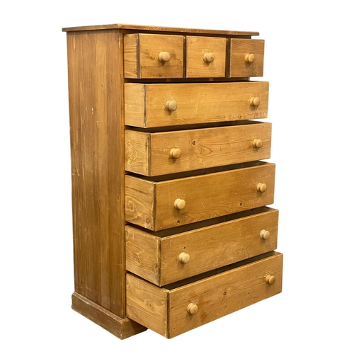 267 - A tall heavy pine chest of drawers. 91x48x147cm