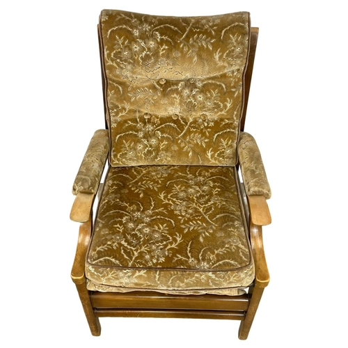 305 - A vintage Cintique armchair.