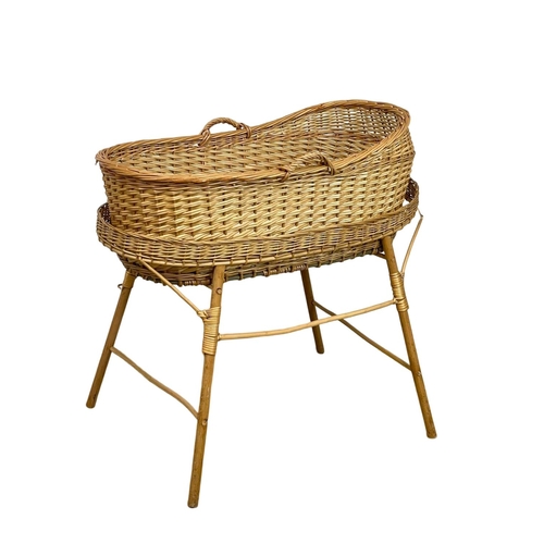 308 - A wicker cot. 90x102cm