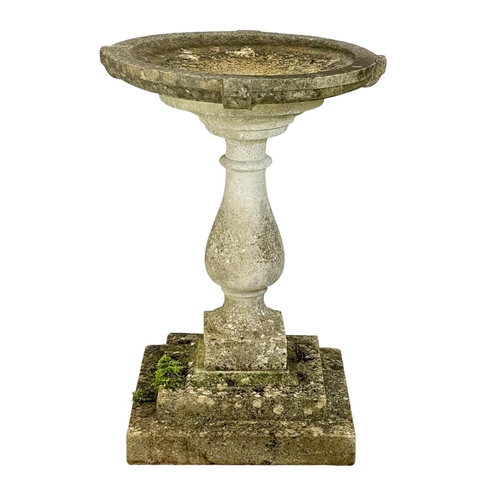 313 - A large concrete garden birdbath. 56x79cm