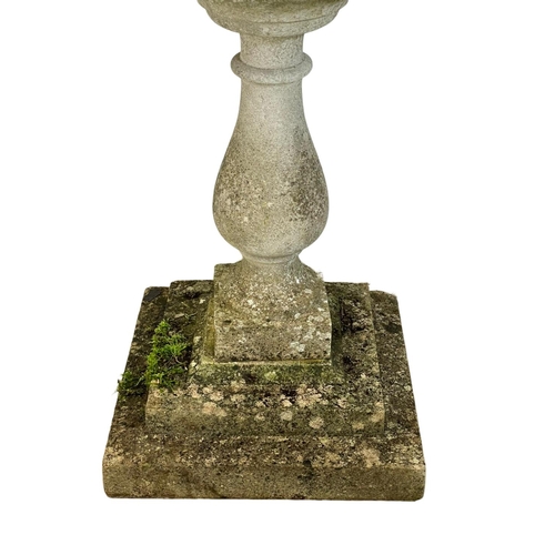 313 - A large concrete garden birdbath. 56x79cm