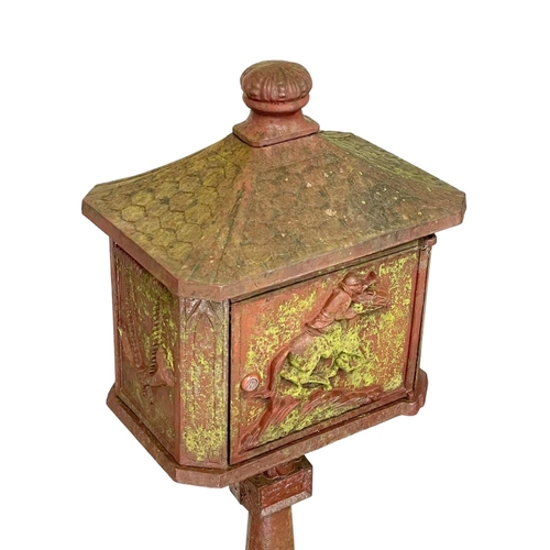 315 - A cast iron post box. 116cm