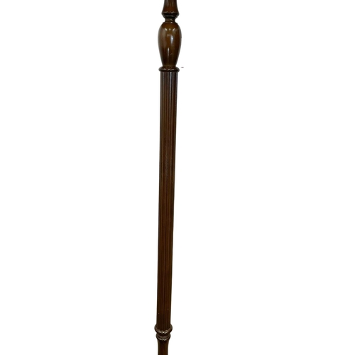 65 - A vintage mahogany standard lamp. 183cm